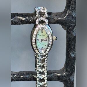 Peire Bernie oval shape Silver and Rhinestone women’s watch.